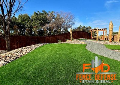 dark stained wood fence in Frisco