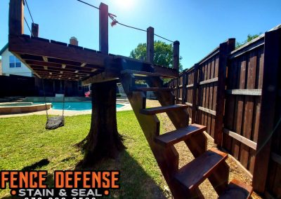 Professionally Stained Fence and Tree Fort